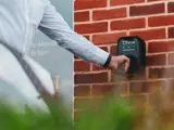 An Ohme EV charger in use at a Hopkins Homes development