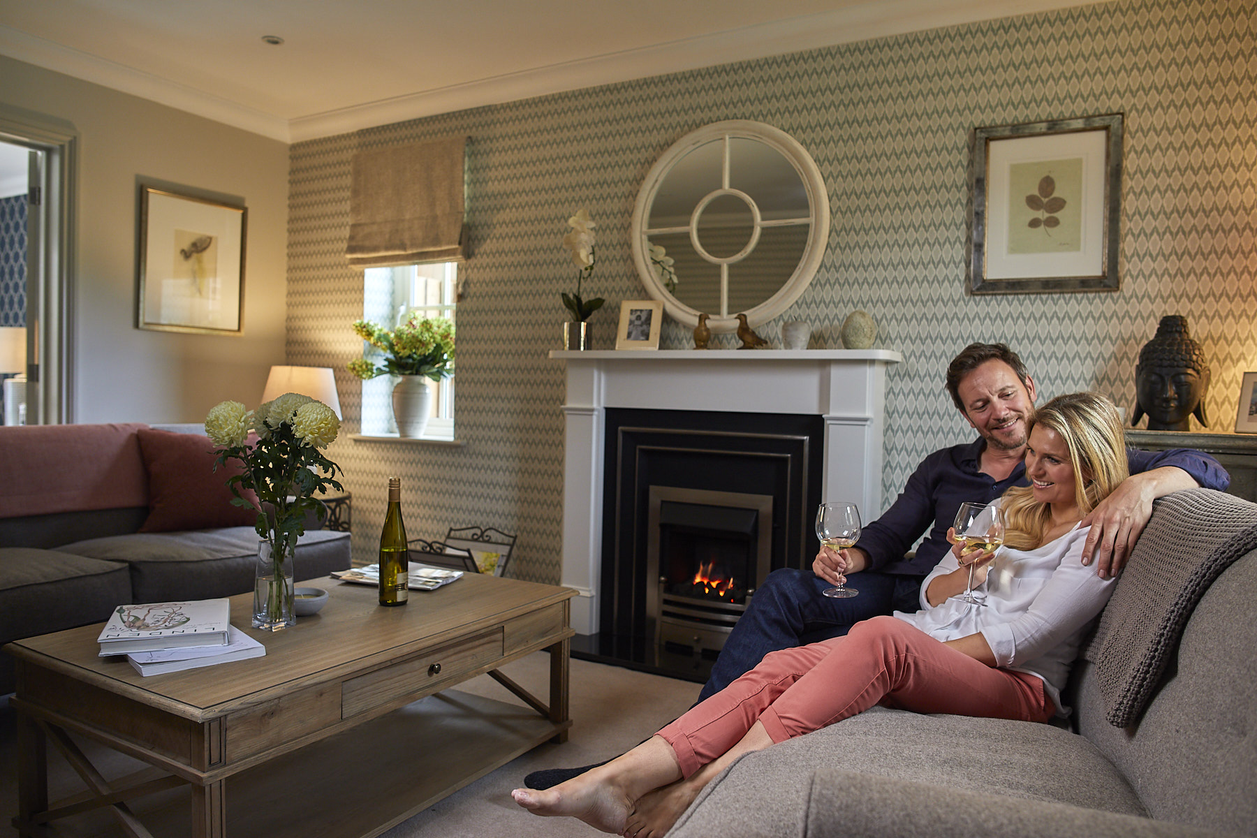 Man and woman drinking wine in a Hopkins Homes living room