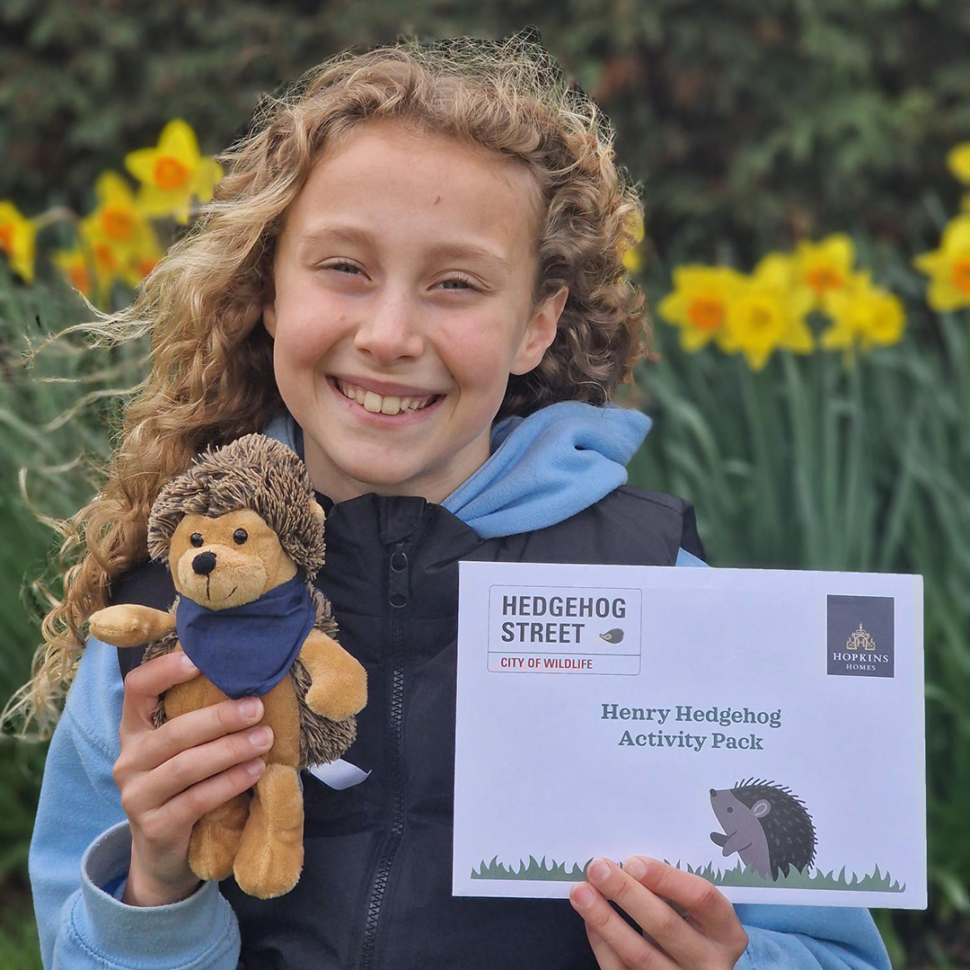 Girl withy hedgehog and leaflet