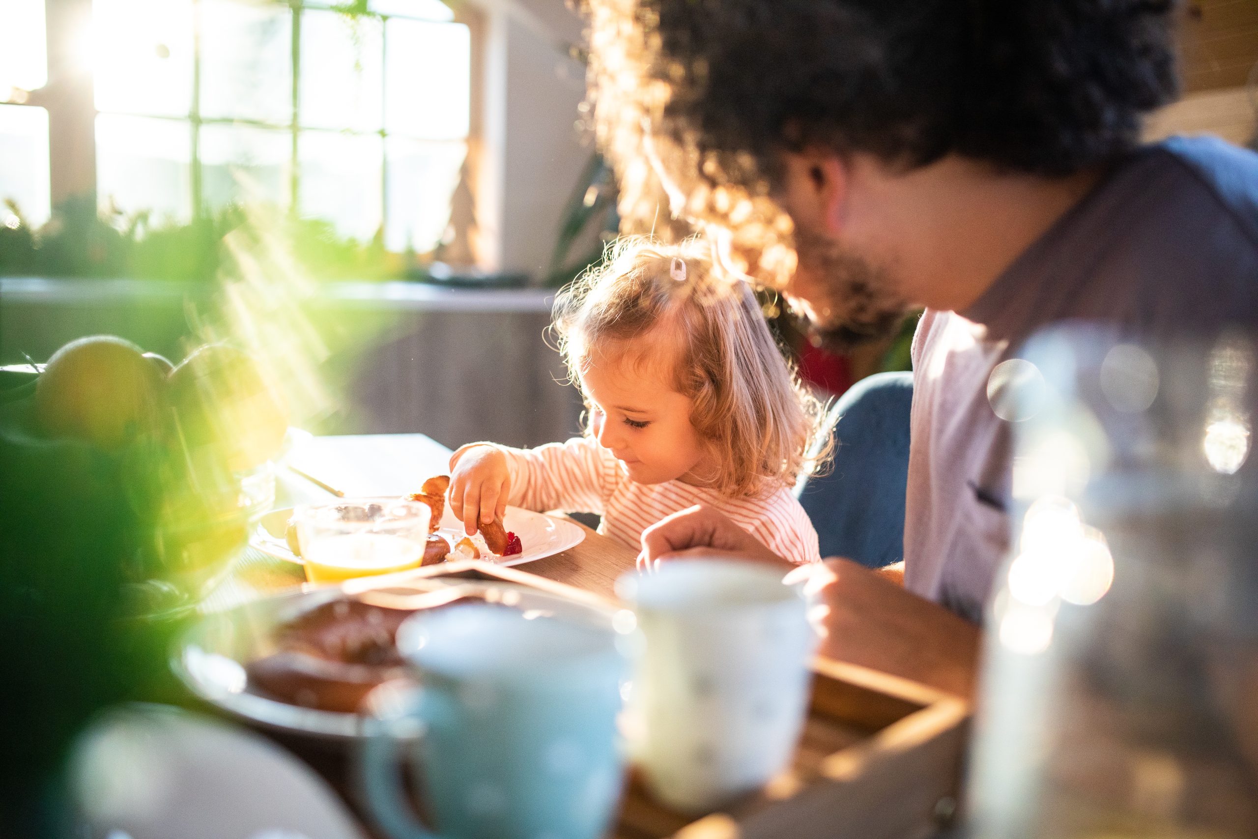Girl in kitchen with father