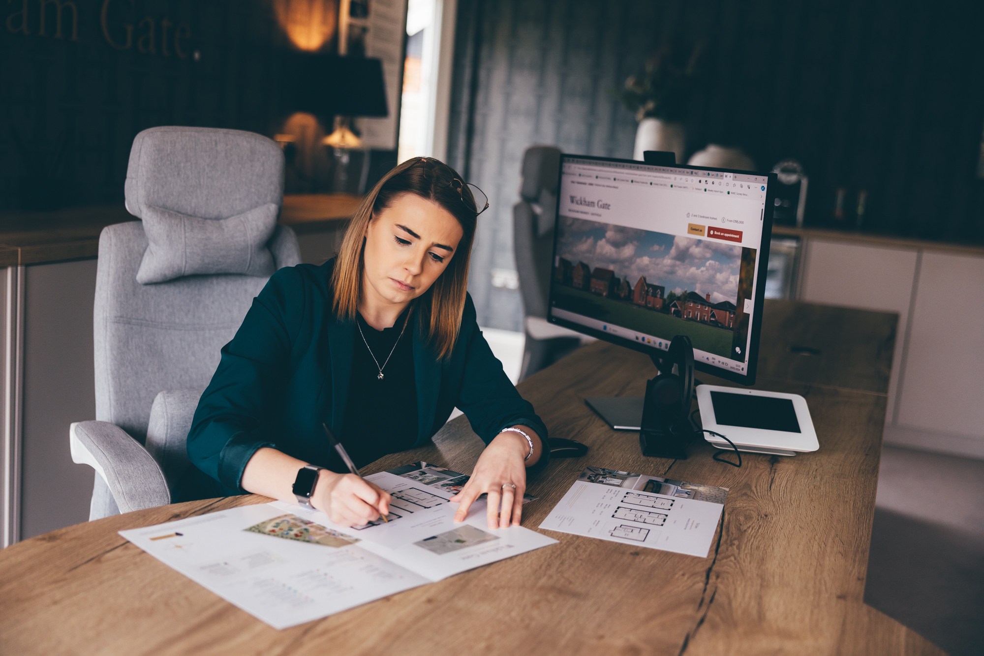 lady writing at desk
