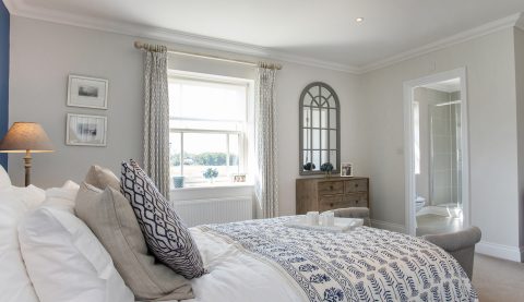 1762 Master bedroom and ensuite blue throw - Hopkins Homes