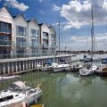 Boats moored at the Waterside marina apartments at Brightlingsea near Colchester